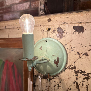 Chippy green paint wall sconce