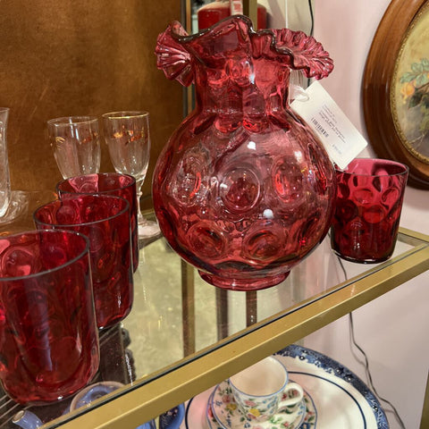 Cranberry glass, thumbprint design, pitcher and six glasses