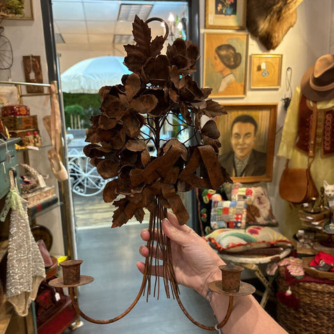 Metal floral candle wall sconce