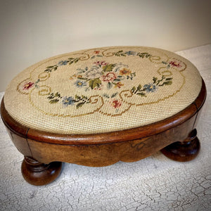 OVAL BURLED WOOD EMBROIDERED FOOTSTOOL W/ BUN FEET. 14"W x 9 3/4"D x 5 1/2"H. Swoon