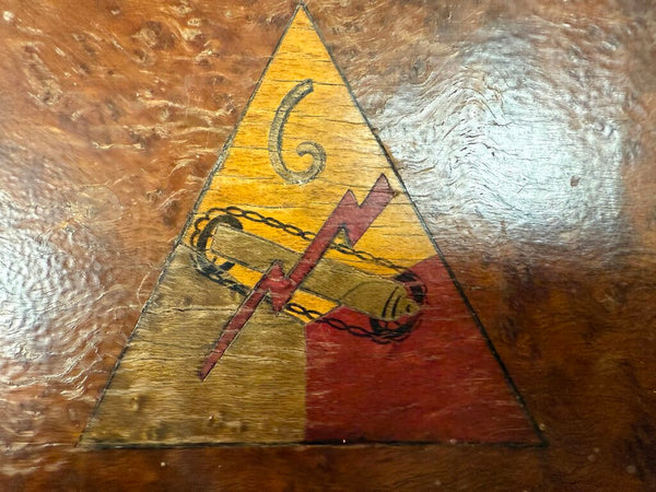 Vintage buried wood box with emblem of the 6th Tank Battalion, WWII