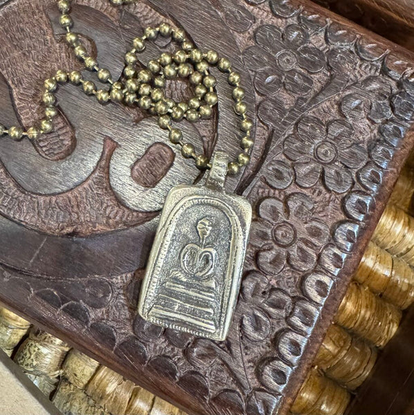 Buddha on brass chain