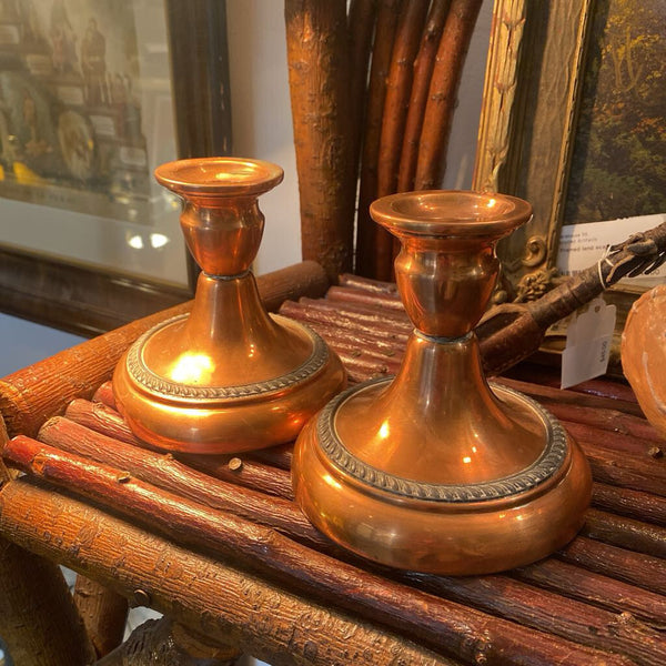 Pair of copper candle holders