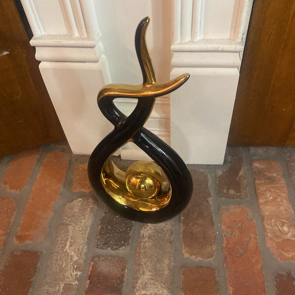 Black and gold MCM sculpture