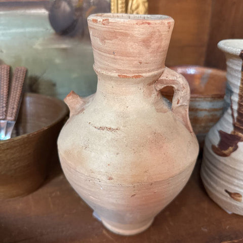 Sand colored primitive pottery jug