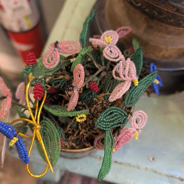 Beaded flower bouquet in brass container