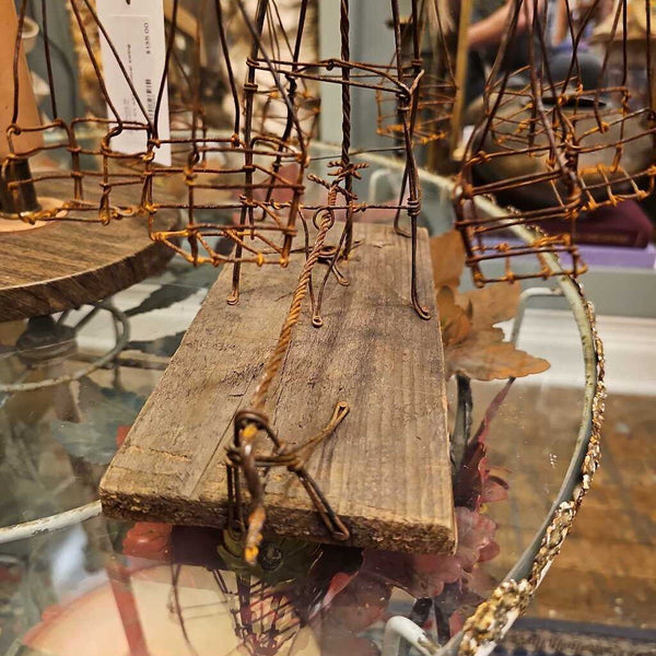 Folk art wire carnival swing