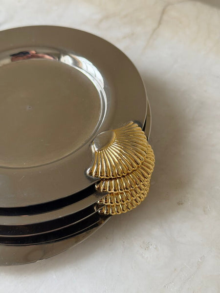 1149 Four silverplate shell coasters