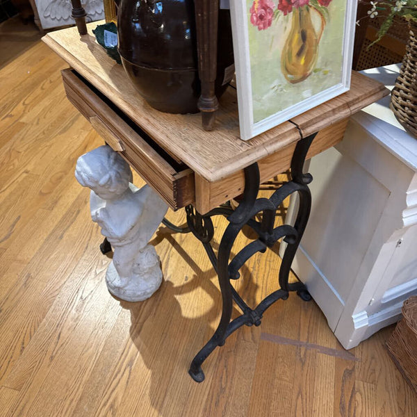 Side table reimagined from salvage iron base and wood top d/ w drawer and shelf