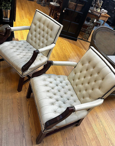 PAIR OF JASPER SEATING ANALINE-DYED WHITE LEATHER AND WOOD TUFTED ARMCHAIRS WITH BRASS NAILHEAD TRIM, AS FOUND. 35"H x 27"D x 24"W. IN STORE PICKUP.