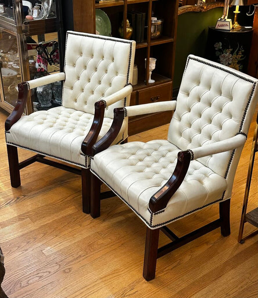 PAIR OF JASPER SEATING ANALINE-DYED WHITE LEATHER AND WOOD TUFTED ARMCHAIRS WITH BRASS NAILHEAD TRIM, AS FOUND. 35"H x 27"D x 24"W. IN STORE PICKUP.