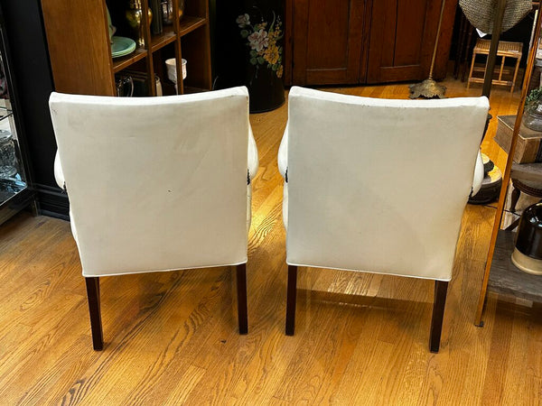 PAIR OF JASPER SEATING ANALINE-DYED WHITE LEATHER AND WOOD TUFTED ARMCHAIRS WITH BRASS NAILHEAD TRIM, AS FOUND. 35"H x 27"D x 24"W. IN STORE PICKUP.