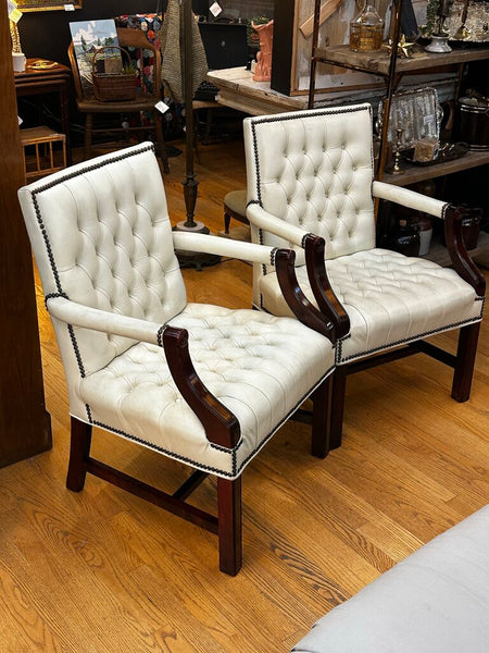 PAIR OF JASPER SEATING ANALINE-DYED WHITE LEATHER AND WOOD TUFTED ARMCHAIRS WITH BRASS NAILHEAD TRIM, AS FOUND. 35"H x 27"D x 24"W. IN STORE PICKUP.