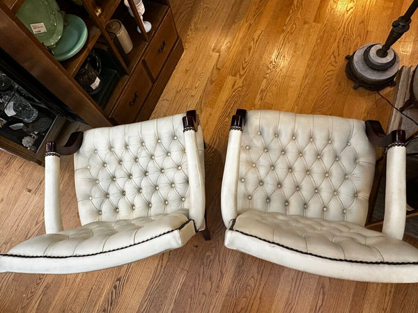 PAIR OF JASPER SEATING ANALINE-DYED WHITE LEATHER AND WOOD TUFTED ARMCHAIRS WITH BRASS NAILHEAD TRIM, AS FOUND. 35"H x 27"D x 24"W. IN STORE PICKUP.