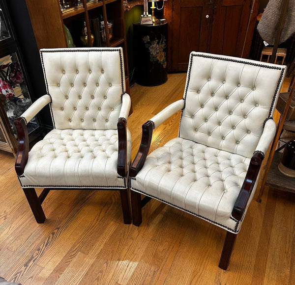 PAIR OF JASPER SEATING ANALINE-DYED WHITE LEATHER AND WOOD TUFTED ARMCHAIRS WITH BRASS NAILHEAD TRIM, AS FOUND. 35"H x 27"D x 24"W. IN STORE PICKUP.