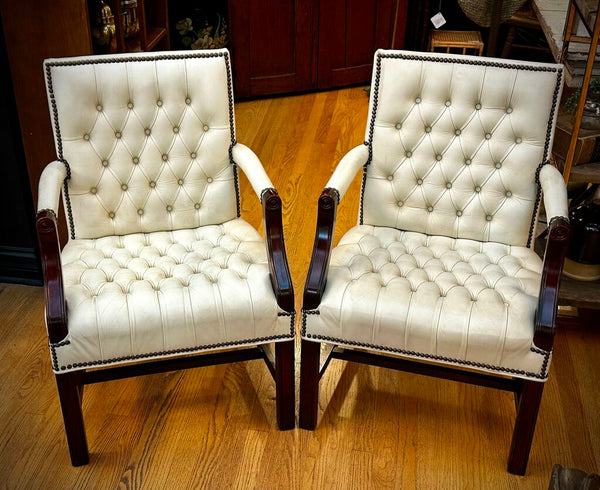 PAIR OF JASPER SEATING ANALINE-DYED WHITE LEATHER AND WOOD TUFTED ARMCHAIRS WITH BRASS NAILHEAD TRIM, AS FOUND. 35"H x 27"D x 24"W. IN STORE PICKUP.
