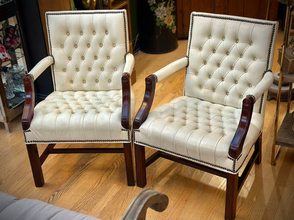 PAIR OF JASPER SEATING ANALINE-DYED WHITE LEATHER AND WOOD TUFTED ARMCHAIRS WITH BRASS NAILHEAD TRIM, AS FOUND. 35"H x 27"D x 24"W. IN STORE PICKUP.