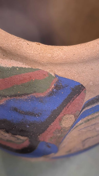Tan with blue and pink Ozark roadside pottery approximately 7 inches