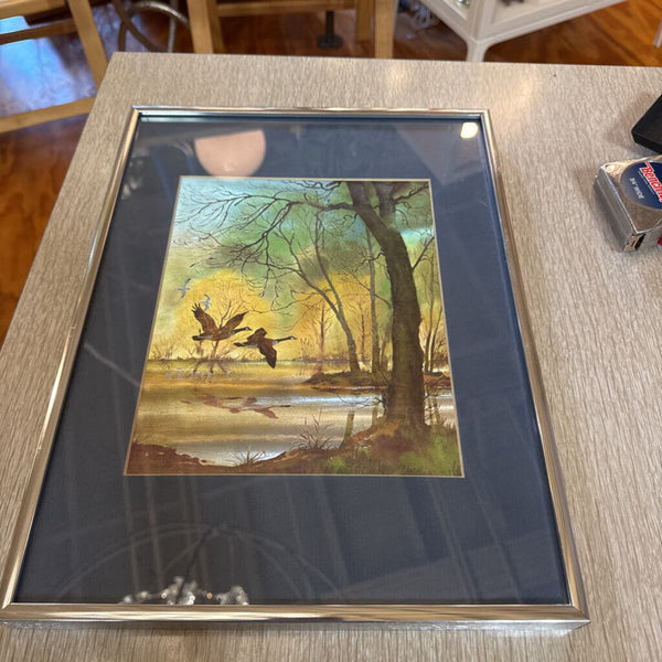 Duck art framed in chrome frame (dimensional effect as if color changes)