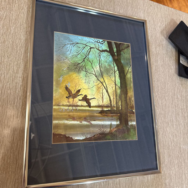 Duck art framed in chrome frame (dimensional effect as if color changes)