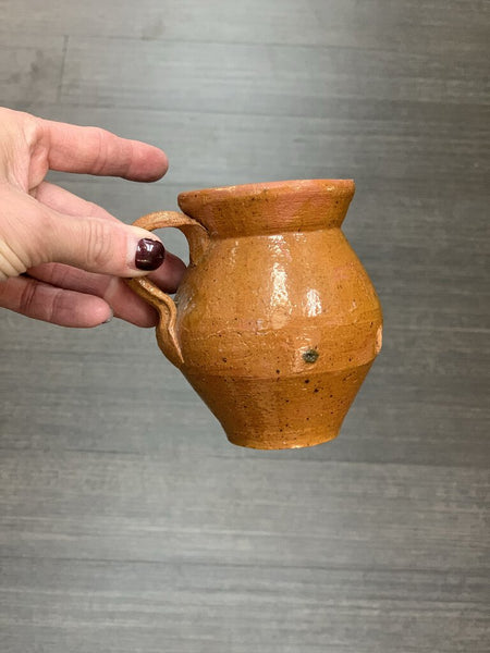 Glazed terra cotta vase with handle